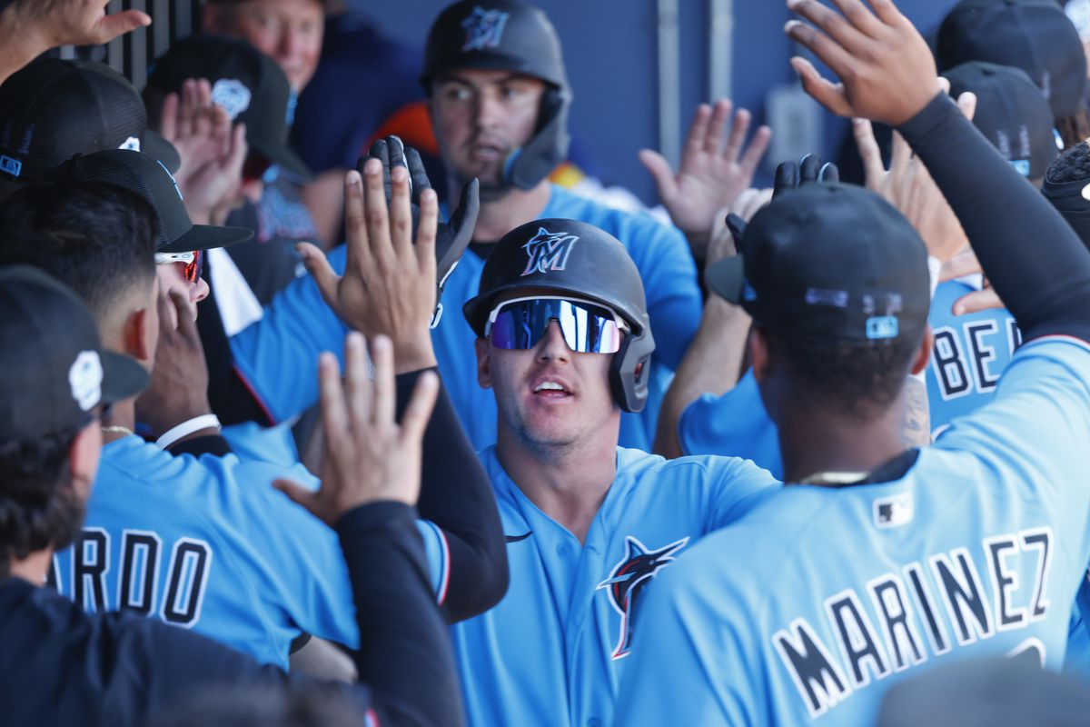 Miami Marlins center fielder Peyton Burdick (6) gets high fives from teammates after hitting a home run during the second inning against the Houston Astros at The Ballpark of the Palm Beaches.&nbsp;