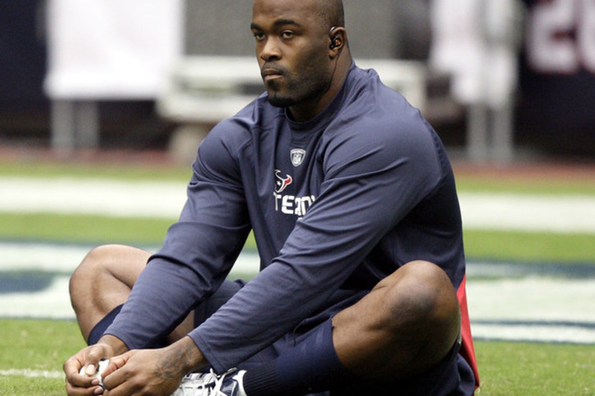 HOUSTON - SEPTEMBER 26:  Defensive end Mario Williams stetches during pre-game warm ups before playing the Dallas Cowboys at Reliant Stadium on September 26 2010 in Houston Texas.  (Photo by Bob Levey/Getty Images)