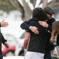 Jackson Brooks, 14, a ninth-grade student at Mueller Park Junior High School, is reunited with his father, Mitchell Brooks, second from right, and uncle, Michael Brooks, left, after a shooting at the school in Bountiful on Thursday, Dec. 1, 2016.