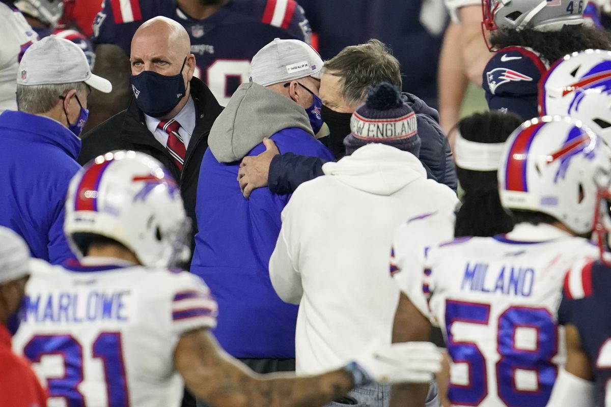 New England Patriots head coach Bill Belichick speaks with Buffalo Bills head coach Sean McDermott during an NFL game on December 28, 2020 in Foxborough, Massachusetts.