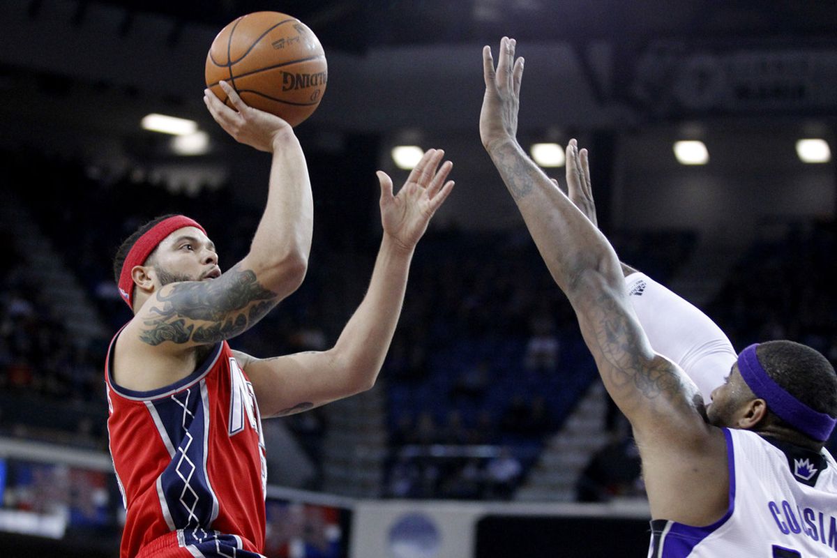 March 31, 2012; Sacramento, CA, USA; New Jersey Nets guard Deron Williams (8) attempts a shot against the Sacramento Kings in the first quarter at the Power Balance Pavilion. Mandatory Credit: Cary Edmondson-US PRESSWIRE