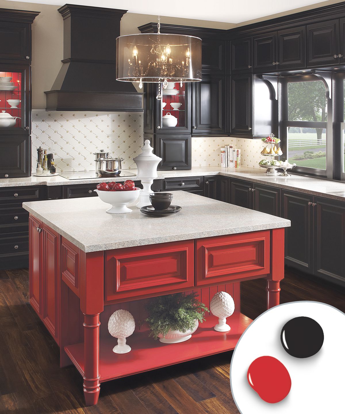 Bold red kitchen island with white countertop in front of black kitchen cabinets.