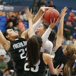 East's Liana Kaitu'uis surrounded by the Highland defense in the 5A high school girls semifinal game in Salt Lake City on Friday, Feb. 23, 2018.