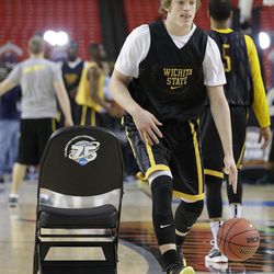 Wichita State's Ron Baker moves the ball during practice for their NCAA Final Four tournament college basketball semifinal game against Louisville, Friday, April 5, 2013, in Atlanta. Wichita State plays Louisville in a semifinal game on Saturday. 