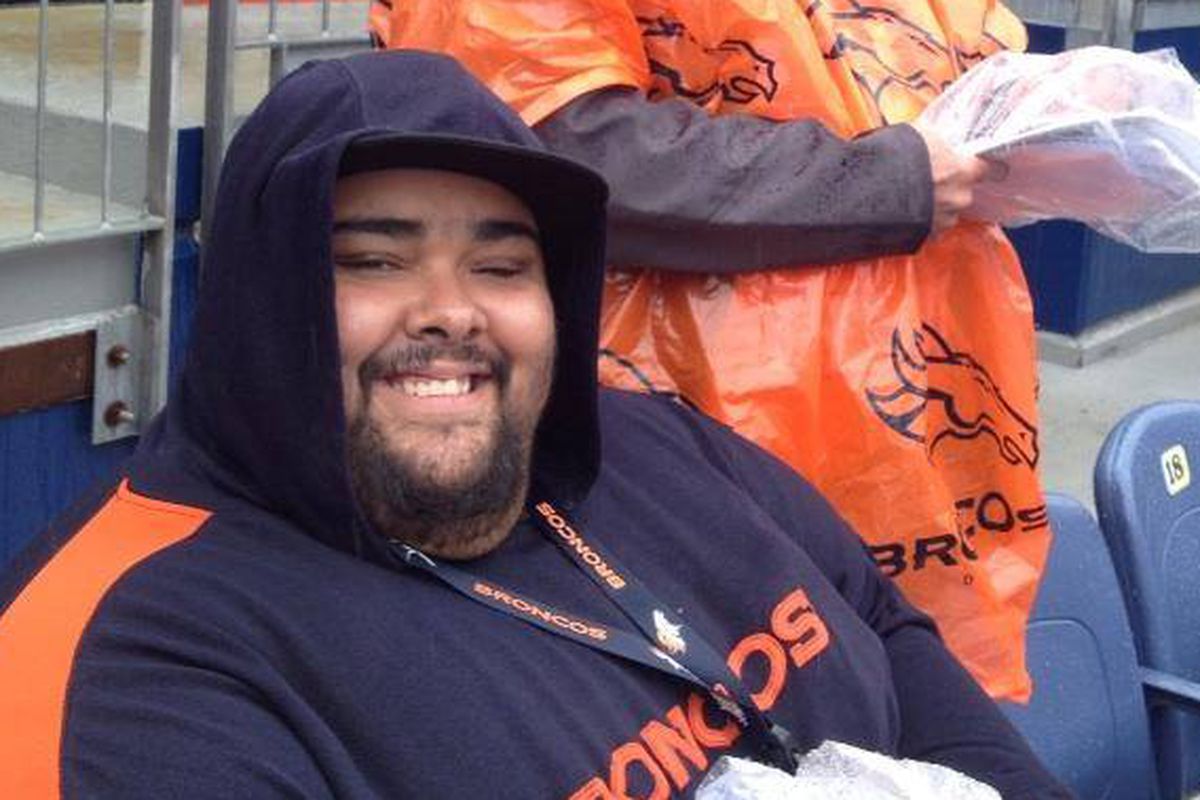 Bronco Mike surviving the rain at the Broncos scrimmage in 2014.