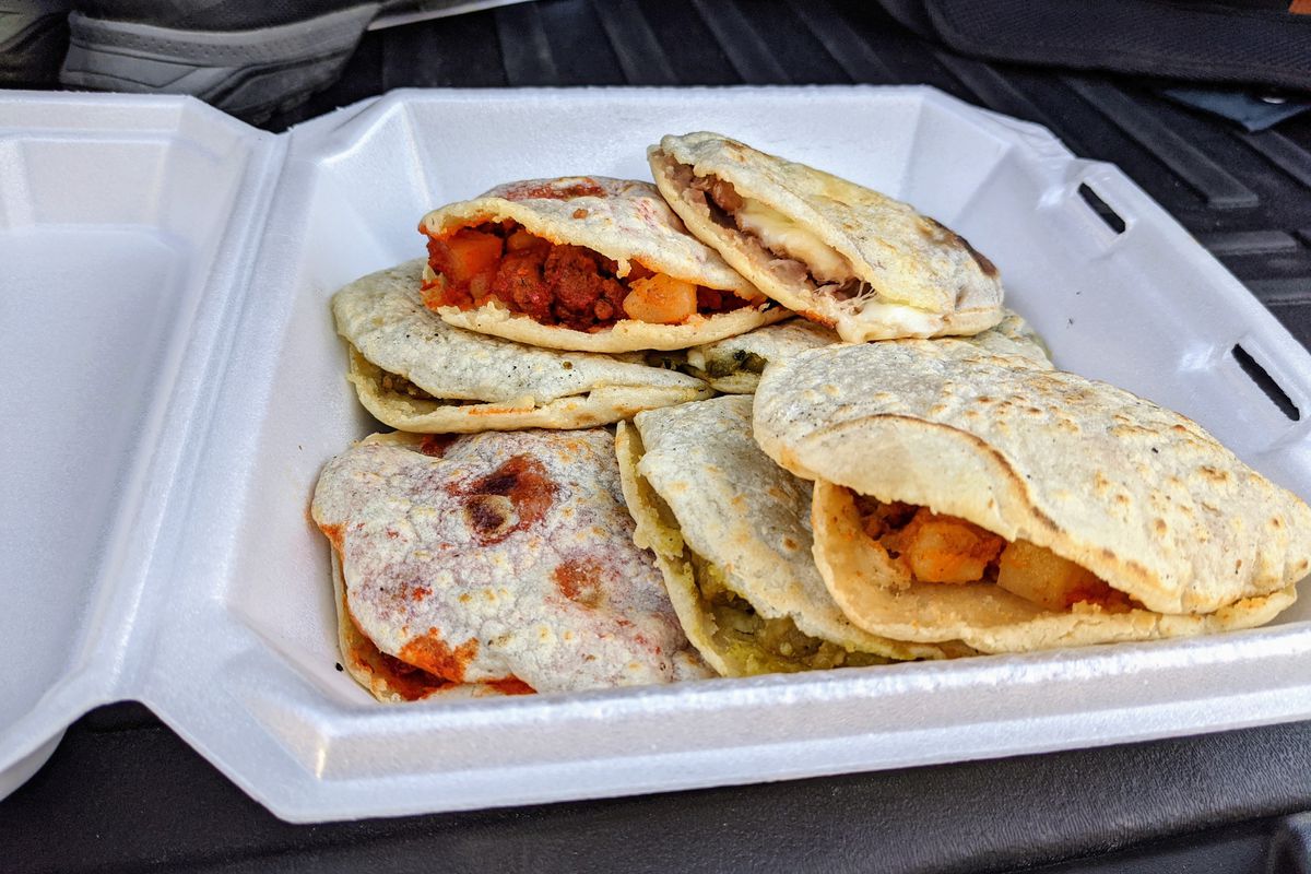 Gorditas in a plastic tray.