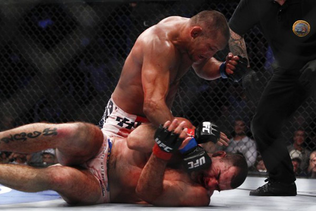 Dan Henderson delivers some ground-and-pound on Mauricio Rua after landing a takedown 