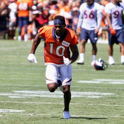 Wide receiver Emmanuel Sanders runs through an individual drill during the first day of Denver Broncos training camp. 