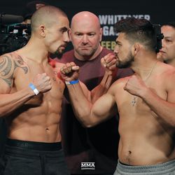 Robert Whittaker and Kelvin Gastelum square off at UFC 234 weigh-ins.