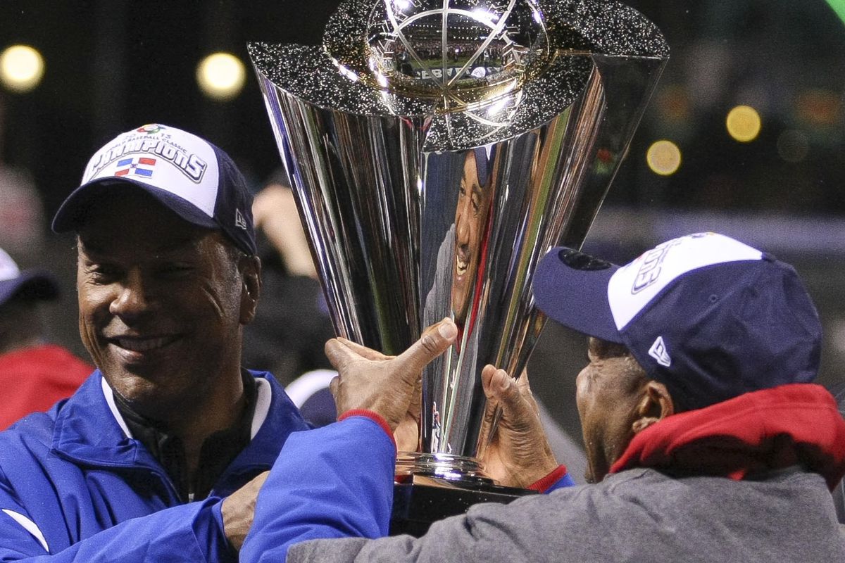 Moises Alou hands off WBC trophy. You might want to wash your hands now.