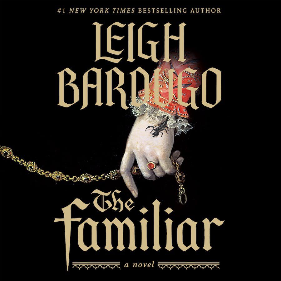 An insect crawls on a bejeweled hand in the cover for Leigh Bardugo’s The Familiar.