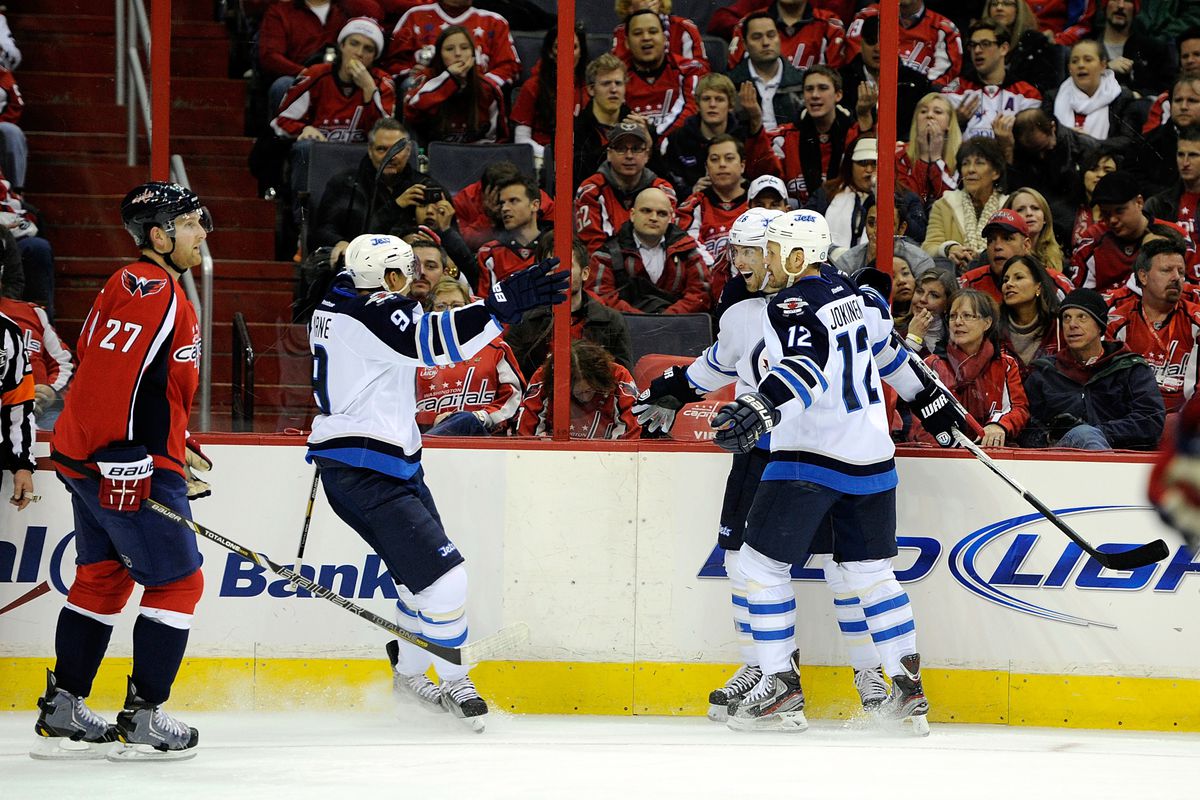 Evander Kane, #9, congratulates Blake Wheeler after his goal in Washington Tuesday night at the Capitals home opener. Jets won the game 4-2.