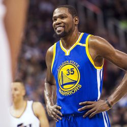 Golden State forward Kevin Durant (35) smiles at a fan after scoring a bucket in the second half of an NBA basketball game against Utah in Salt Lake City on Thursday, Dec. 8, 2016. Golden State defeated Utah with a final score of 106-99.