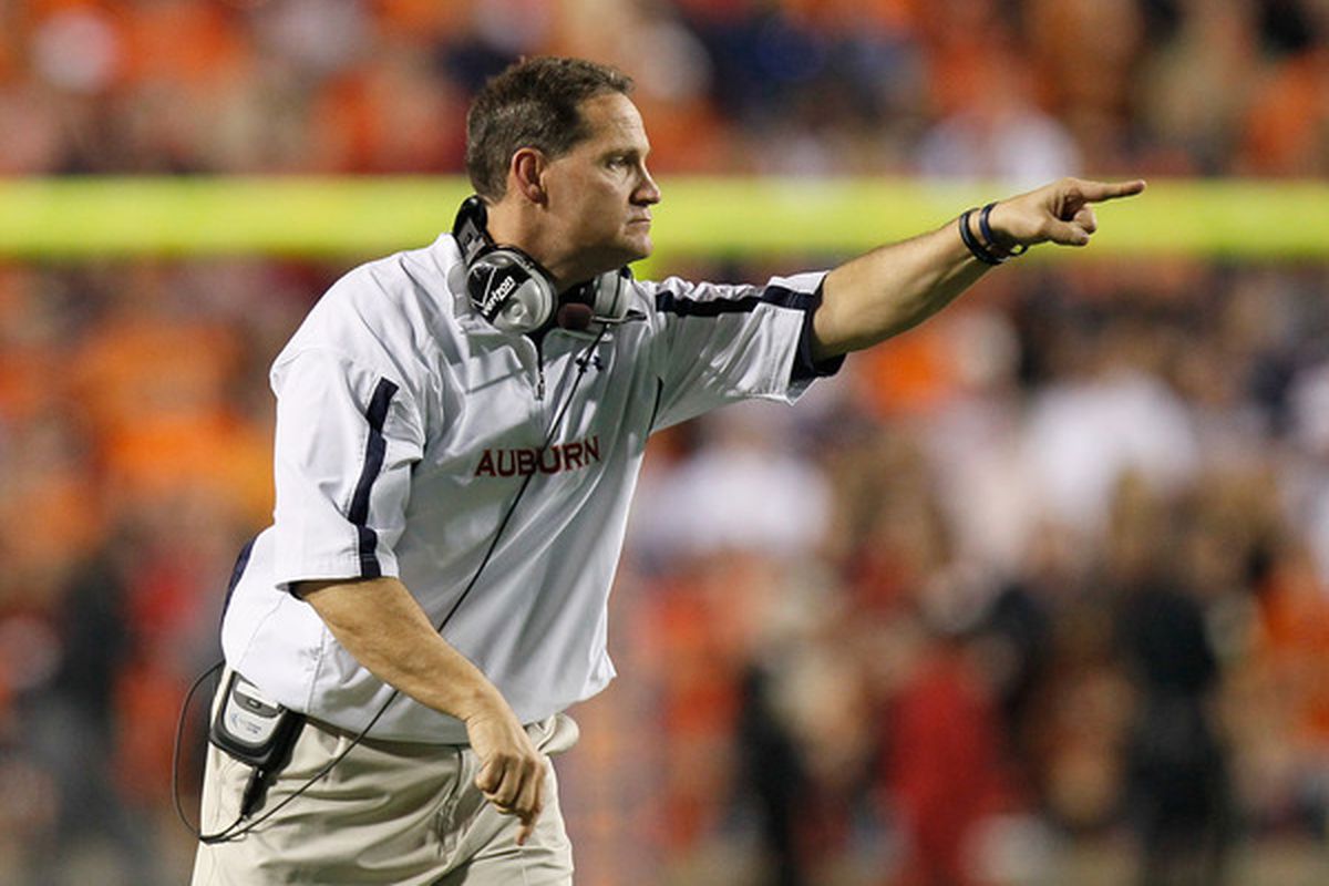 AUBURN AL - NOVEMBER 13:  Head coach Gene Chizik of the Auburn Tigers points to his offense during the game against the Georgia Bulldogs at Jordan-Hare Stadium on November 13 2010 in Auburn Alabama.  (Photo by Kevin C. Cox/Getty Images)