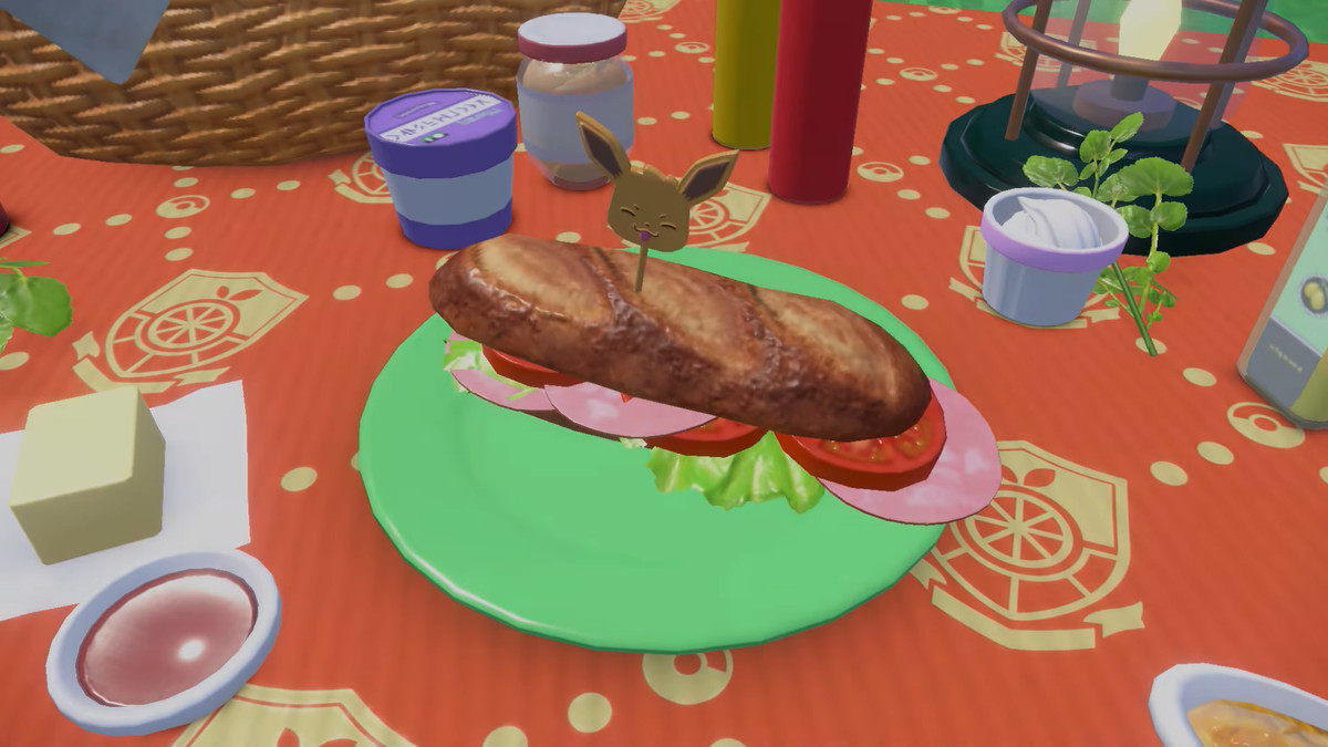 a ham sandwich on a table, surrounded by ingredients, with an eevee pick holding it together