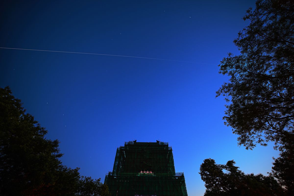 China’s space station core module ‘Tianhe’ flies over the Bell Tower on May 2, 2021 in Beijing, China.