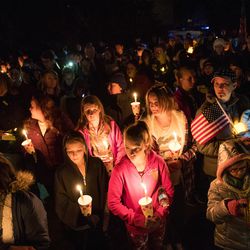 People gather for a vigil honoring Maj. Brent Taylor outside his home in North Ogden on Wednesday, Nov. 7, 2018. Taylor, mayor of North Ogden and a major in the Utah Army National Guard, was killed in Afghanistan on Saturday.