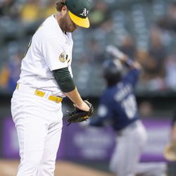 Aug 19, 2022; Oakland, California, USA; Oakland Athletics starting pitcher Cole Irvin (19) reacts to giving up a two-run home to Seattle Mariners third baseman Eugenio Suarez (not pictured) during the fourth inning at RingCentral Coliseum. Mandatory Credit: D. Ross Cameron