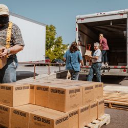 Latter-day Saints from Rochester, New York, volunteer to help unload and sort donated food in preparation for distribution from the truck to local pantries, Rochester, New York, September 22, 2020.  