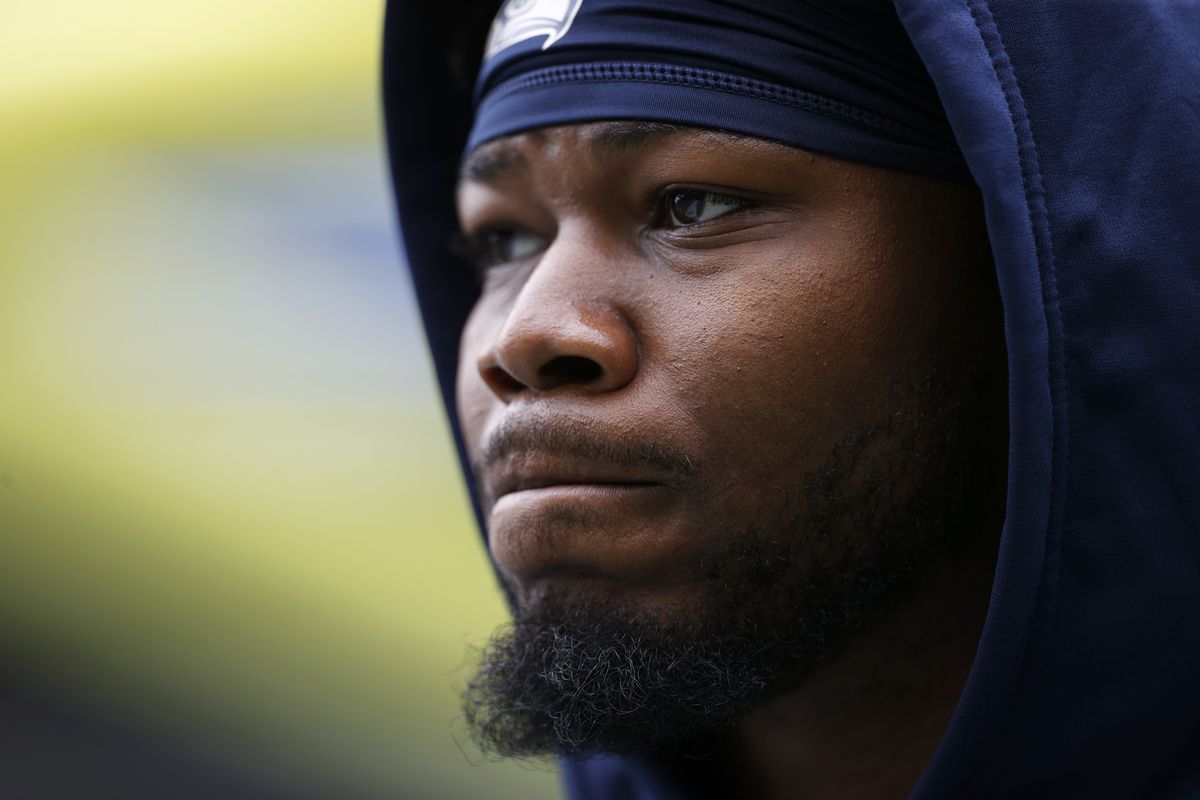 Rashaad Penny #20 of the Seattle Seahawks looks on during warmups before the preseason game between the Seattle Seahawks and the Chicago Bears at Lumen Field on August 18, 2022 in Seattle, Washington.
