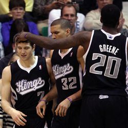 Jimmer Fredette, of Sacramento, gets a pat on the head from Donte Greene as the Sacramento Kings face the Utah Jazz in NBA basketball in Salt Lake City, Friday, March 30, 2012.