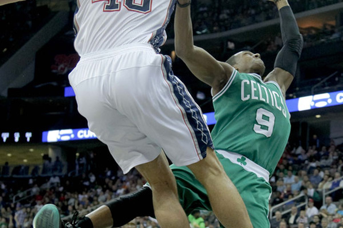 Apr 14, 2012; Newark, NJ, USA;  Boston Celtics point guard Rajon Rondo (9) has shot rejected by New Jersey Nets power forward Kris Humphries (43) as he drives to the basket at the Prudential Center. Mandatory Credit: Jim O'Connor-US PRESSWIRE