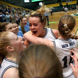 Salem Hills's Dixie Lainhart, Lauren Gustin and Hailey Johnson celebrate their team's likely win in the last minutes of the 4A championship girls basketball game against Salem Hills at the Utah Community Credit Union Center in Orem on Saturday, March 3, 2018. Salem Hills won 57-35.