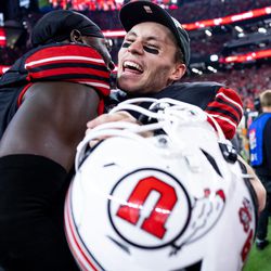 Utah Utes linebacker Devin Lloyd (0) and wide receiver Britain Covey (18) celebrate after the Utes beat the Oregon Ducks in the Pac-12 championship game at Allegiant Stadium in Las Vegas on Friday, Dec. 3, 2021.
