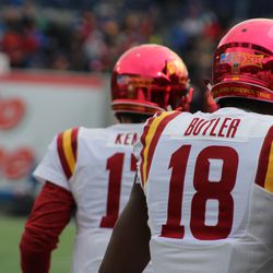 Hakeem Butler and Kyle Kempt return to the sideline after their 52 yard touchdown pass play.