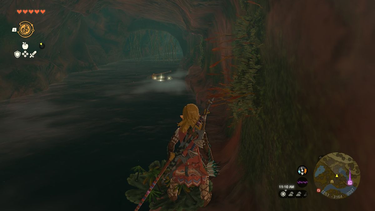 Link walks down a river in a cave in Zelda Tears of the Kingdom.
