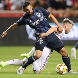 Real Salt Lake midfielder Albert Rusnák (11) falls as he battles Los Angeles Galaxy midfielder Sebastian Lletget (17) for the ball as Real Salt Lake and the LA Galaxy play at Rio Tinto Stadium in Sandy on Wednesday, Sept. 25, 2019.