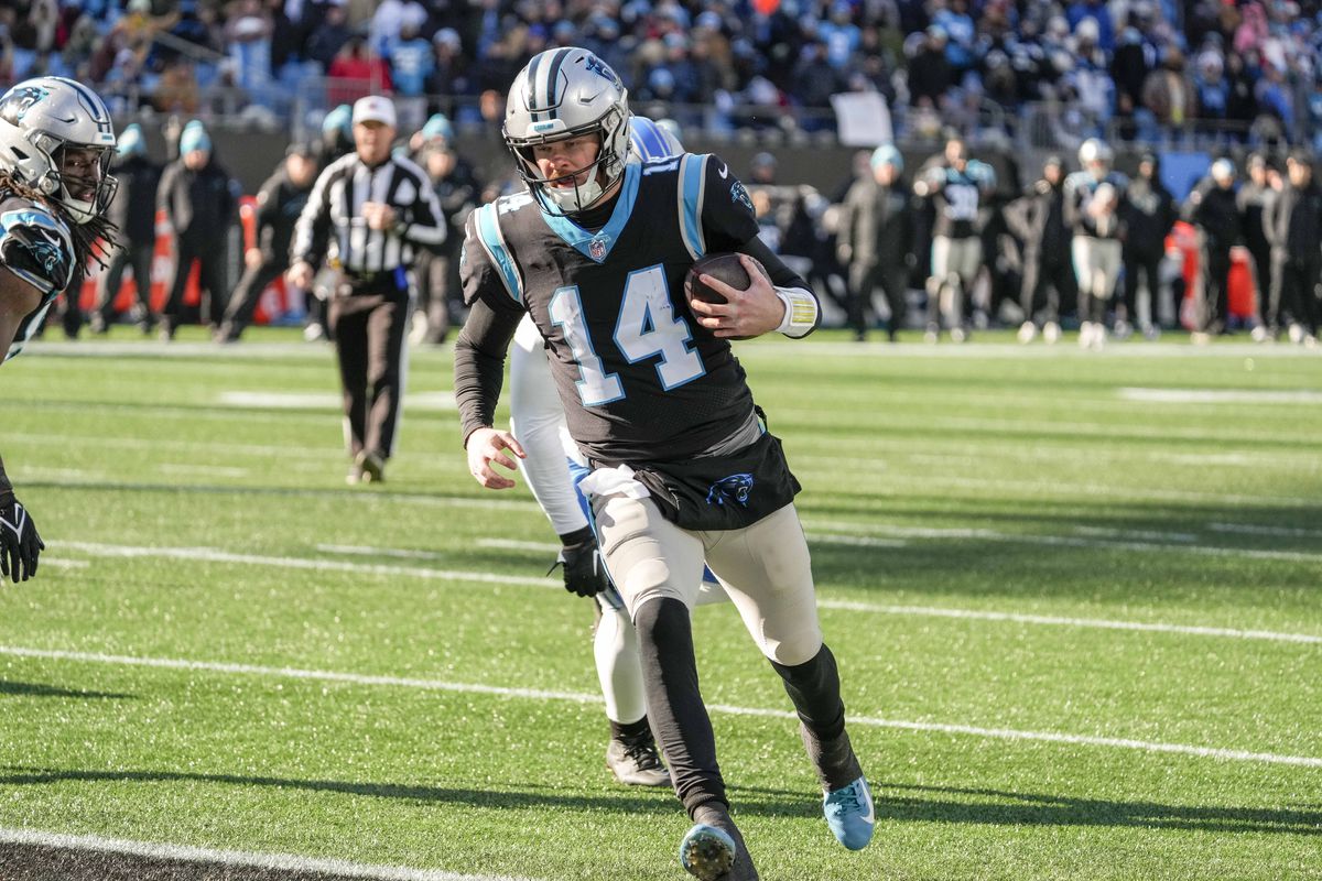Carolina Panthers quarterback Sam Darnold (14) runs for a touchdown during the second quarter against the Detroit Lions at Bank of America Stadium.