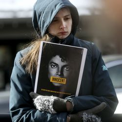 Morgan Steffen protests "Leaving Neverland," a documentary about Michael Jackson, outside of the Egyptian Theatre during the Sundance Film Festival in Park City on Friday, Jan. 25, 2019.