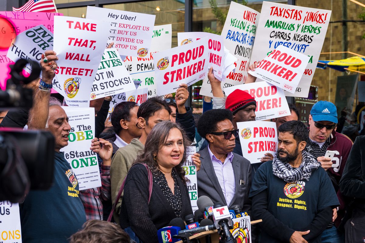 NYC cab drivers rallied in front of the Uber and Lyft