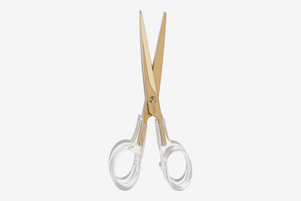 Scissors with transparent handles and gold shears. 
