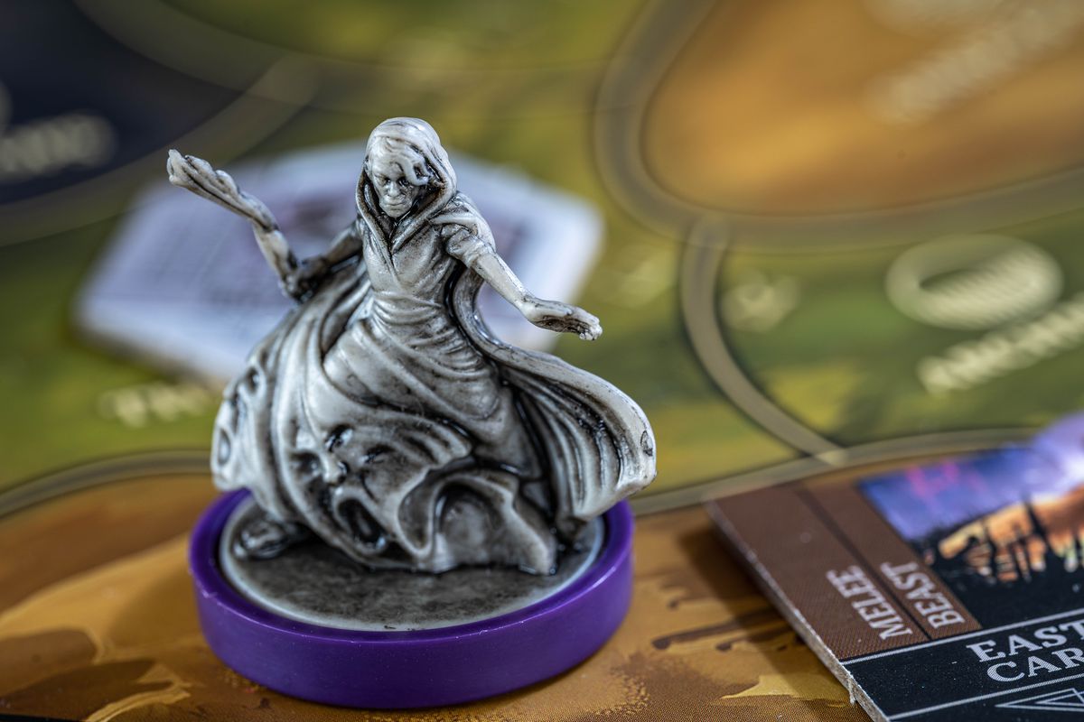 A wizard miniature, delicately highlighted with inks.