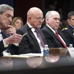 From left, FBI Director Robert Mueller, National Intelligence Director James Clapper; CIA Director John Brennan, and Department of Defense's Defense Intelligence Agency Director Lt. Gen. Michael Flynn, testify on Capitol Hill in Washington, Thursday, April 11, 2013, before the House Intelligence Committee hearing on worldwide threats.   (AP Photo/Manuel Balce Ceneta)