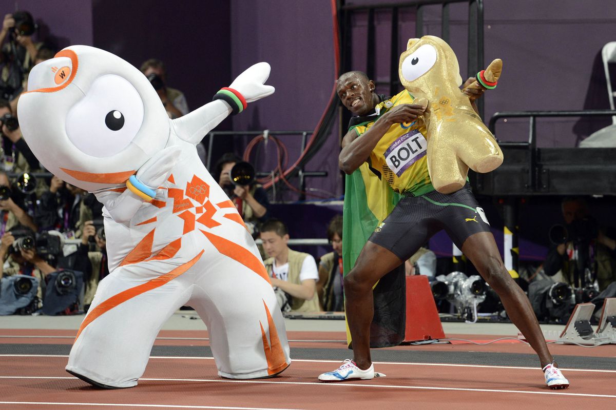 Aug 5, 2012; London, United Kingdom; Usain Bolt (JAM) celebrates with a plush toy and the Olympics mascot after winning the men's 100m final during the 2012 London Olympic Games at Olympic Stadium. Mandatory Credit: John David Mercer-USA TODAY Sports