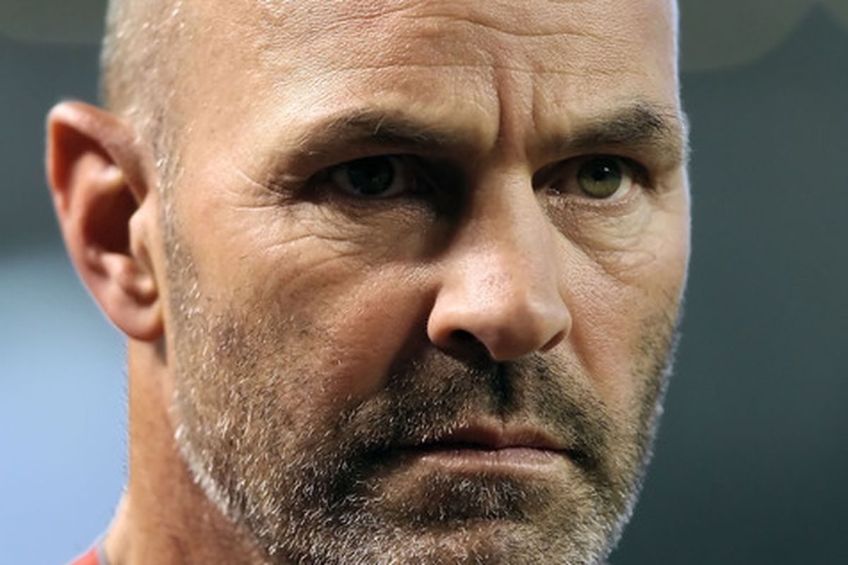 Kirk Gibson's bald head and fiery personality are expected to remain manager of the Arizona Diamondbacks through 2012.
