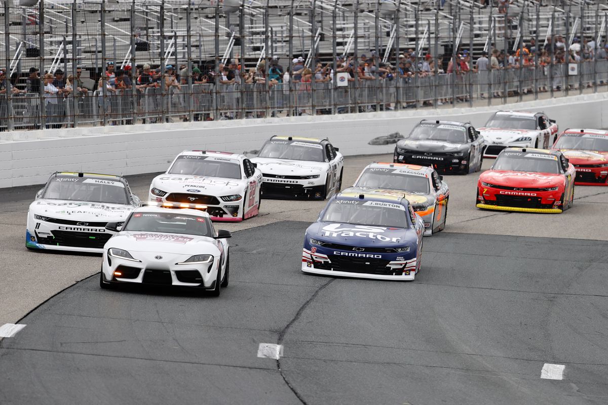 Cars line up behind the pace car in turn 1 before the Xfinity Series - Ambetter Get Vaccinated 200 on July 17, 2021 at New Hampshire Motor Speedway in Loudon, New Hampshire.