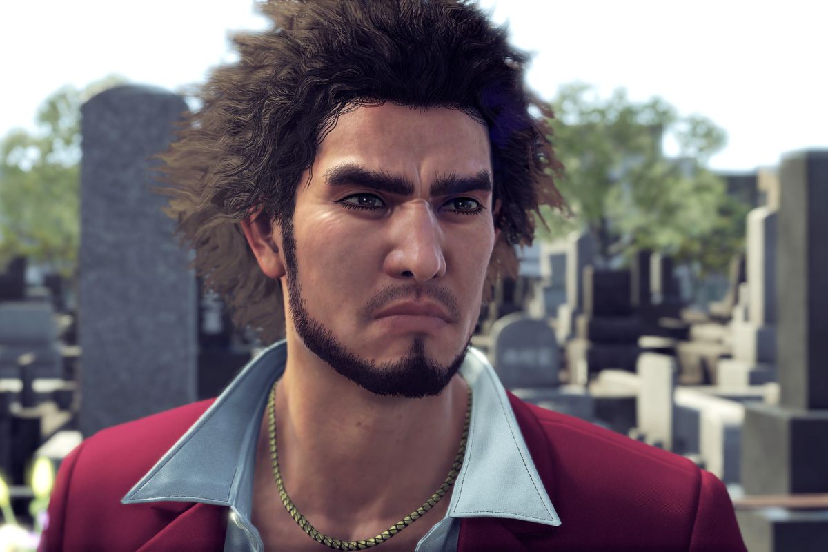 a close-up of Ichiban Kasuga, the protagonist of Yakuza: Like a Dragon, wearing a white dress shirt with a very open collar beneath a burgundy sport coat