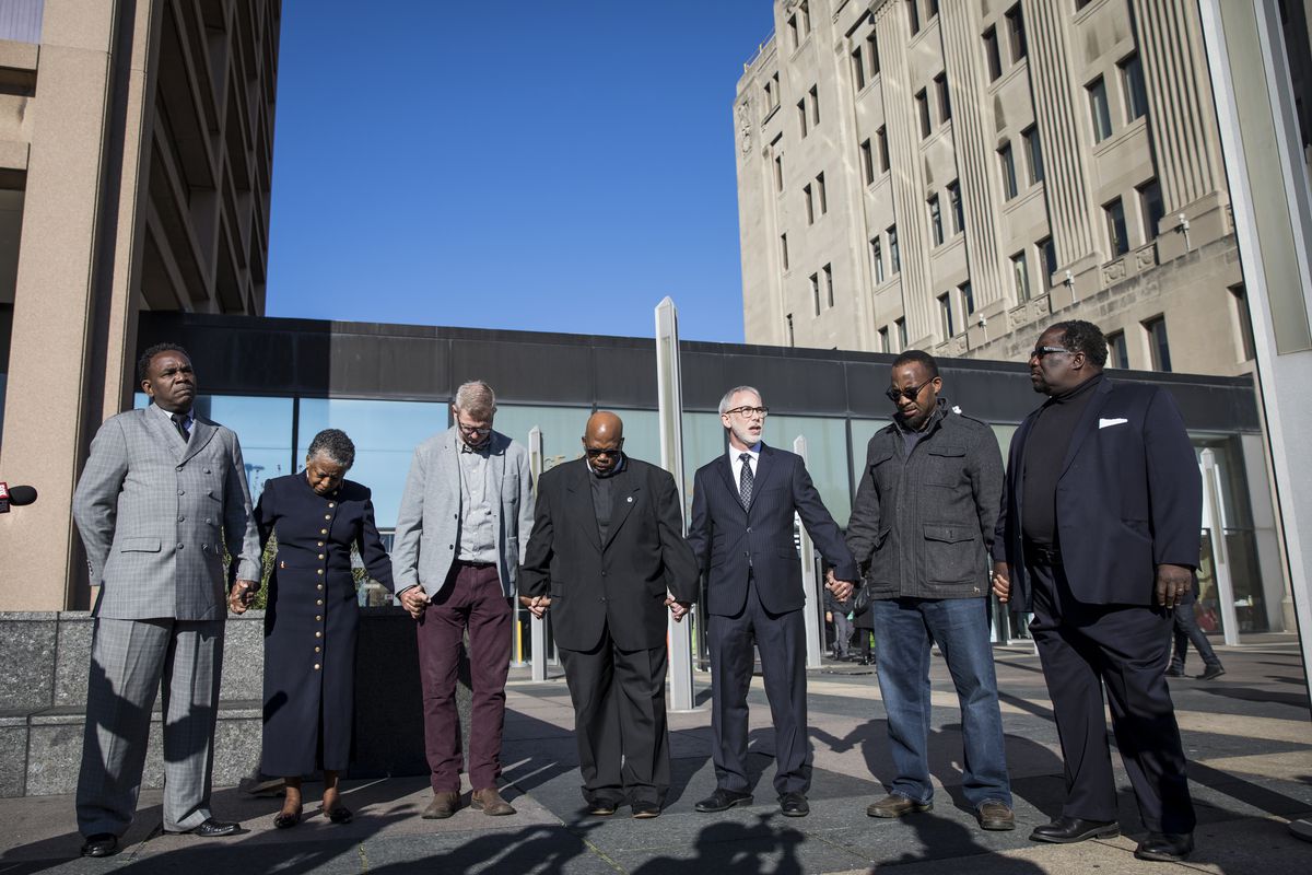 From left to right, Rev. Ira Acree, Rev. Jeanette Wilson, Rev. Tim Hoekstra, Rev. Robert Biekman, Rabbi Max Weiss, Pastor Eric Pernell and Rev. Marshall Hatch pray for “justice for Laquan McDonald” outside the Leighton Criminal Courthouse before the murde