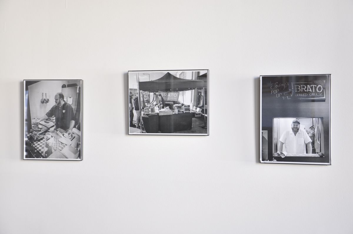 three black and white photos on a white wall