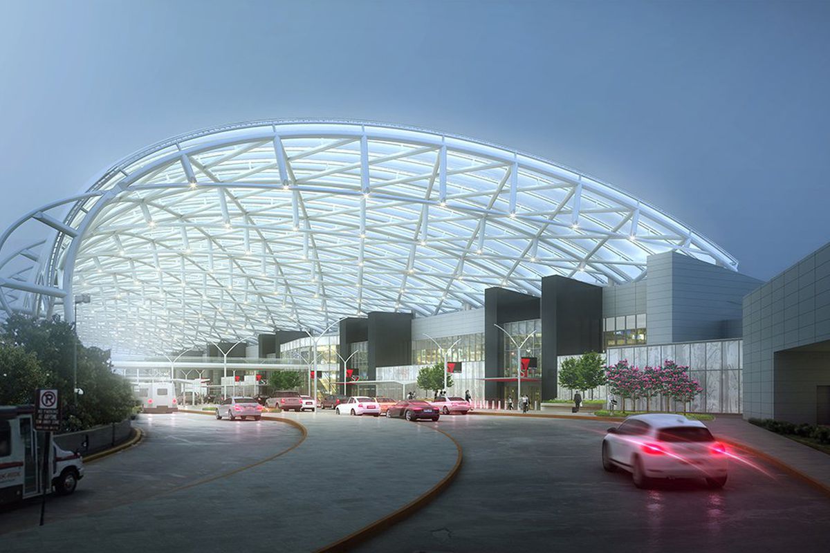 A four-story arching metal tube system above the entry drive for the airport.