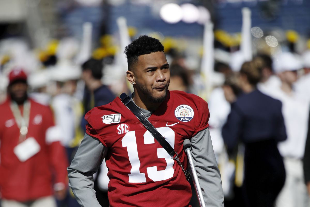 Injured quarterback Tua Tagovailoa of the Alabama Crimson Tide leaves the field following warmups prior to the Vrbo Citrus Bowl against the Michigan Wolverines at Camping World Stadium on January 1, 2020 in Orlando, Florida.