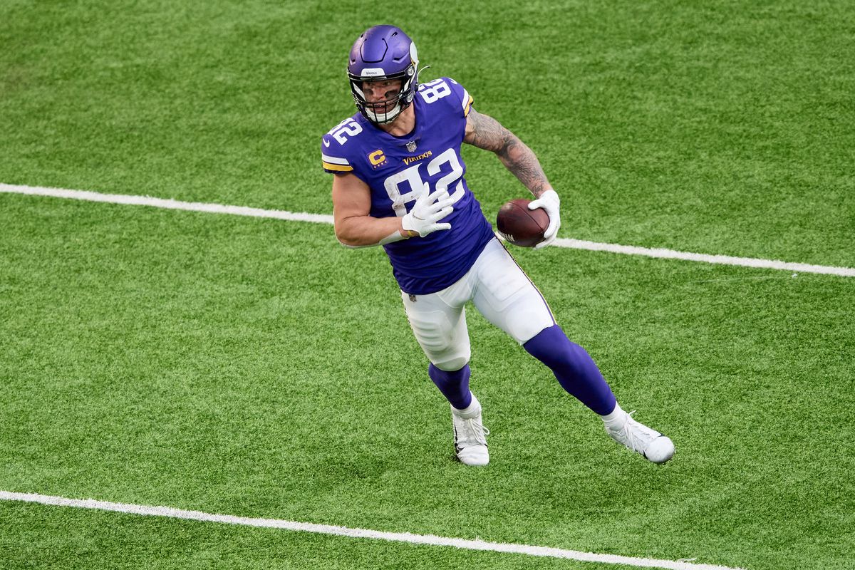 Kyle Rudolph #82 of the Minnesota Vikings carries the ball against the Carolina Panthers during the game at U.S. Bank Stadium on November 29, 2020 in Minneapolis, Minnesota.
