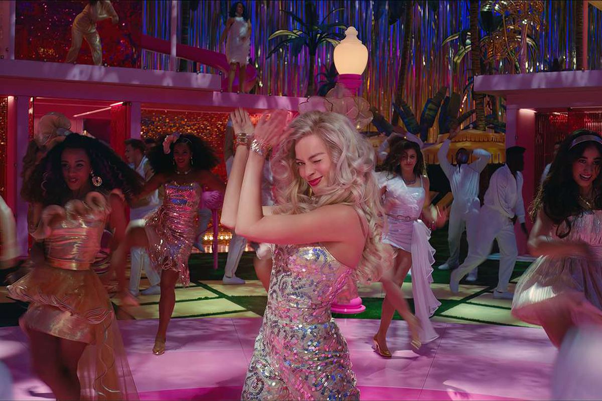 Barbie winks at the camera while flanked by all her friends during a dance sequence.