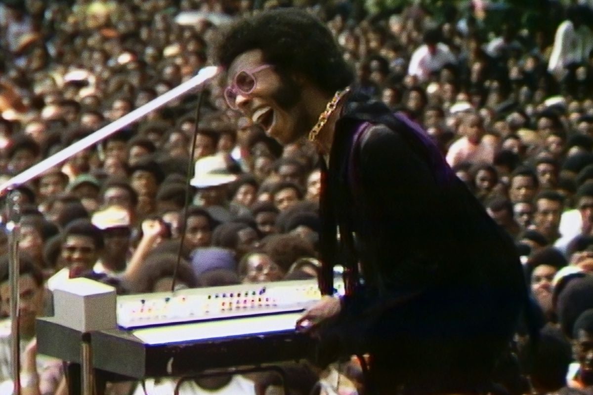 Sly Stone performs at the Harlem Cultural Festival in 1969, featured in the documentary SUMMER OF SOUL. Photo Courtesy of Searchlight Pictures.