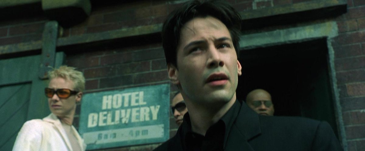 The Matrix: Neo and Switch exit a door