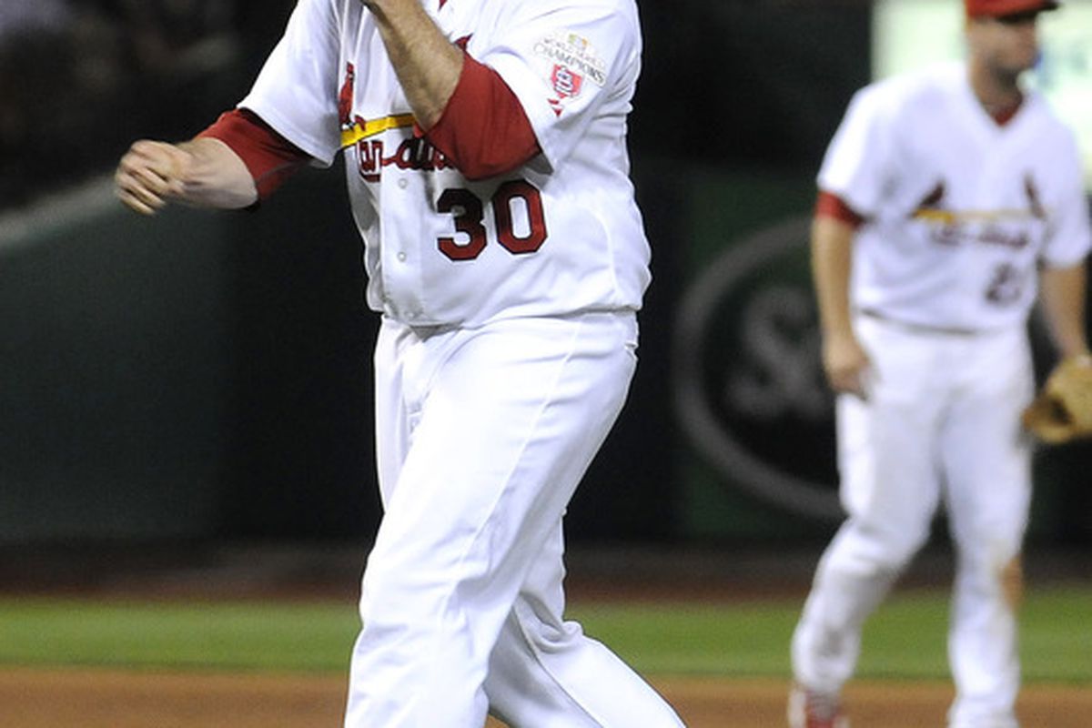 June 13, 2012; St. Louis, MO. USA; St. Louis Cardinals relief pitcher Jason Motte (30) celebrates after closing out a game against the Chicago White Sox at Busch Stadium. St. Louis defeated Chicago 1-0. Mandatory Credit: Jeff Curry-US PRESSWIRE